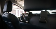 Headrest hangers for personal items in car.